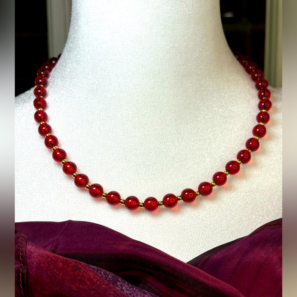 Monet beaded necklace. Beads looks like red glass with small gold toned beads.